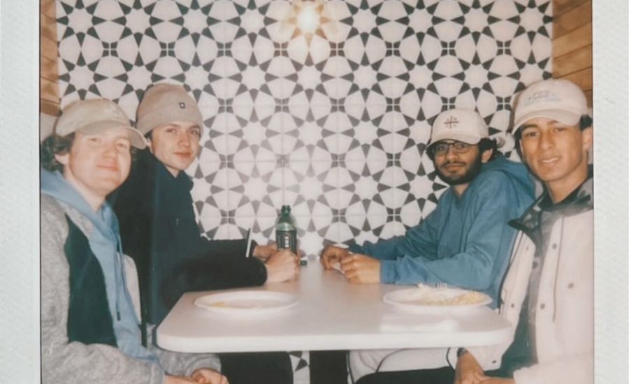 Group of young men eating at table at VERVE St. Louis