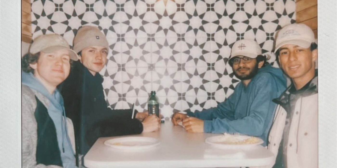 Group of young men eating at table at VERVE St. Louis