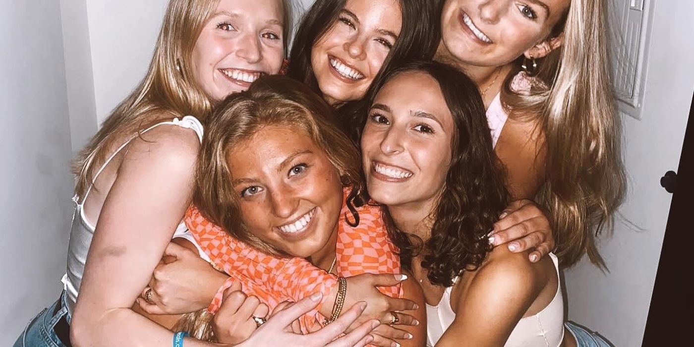 Group of young women hugging at apartment in VERVE St. Louis
