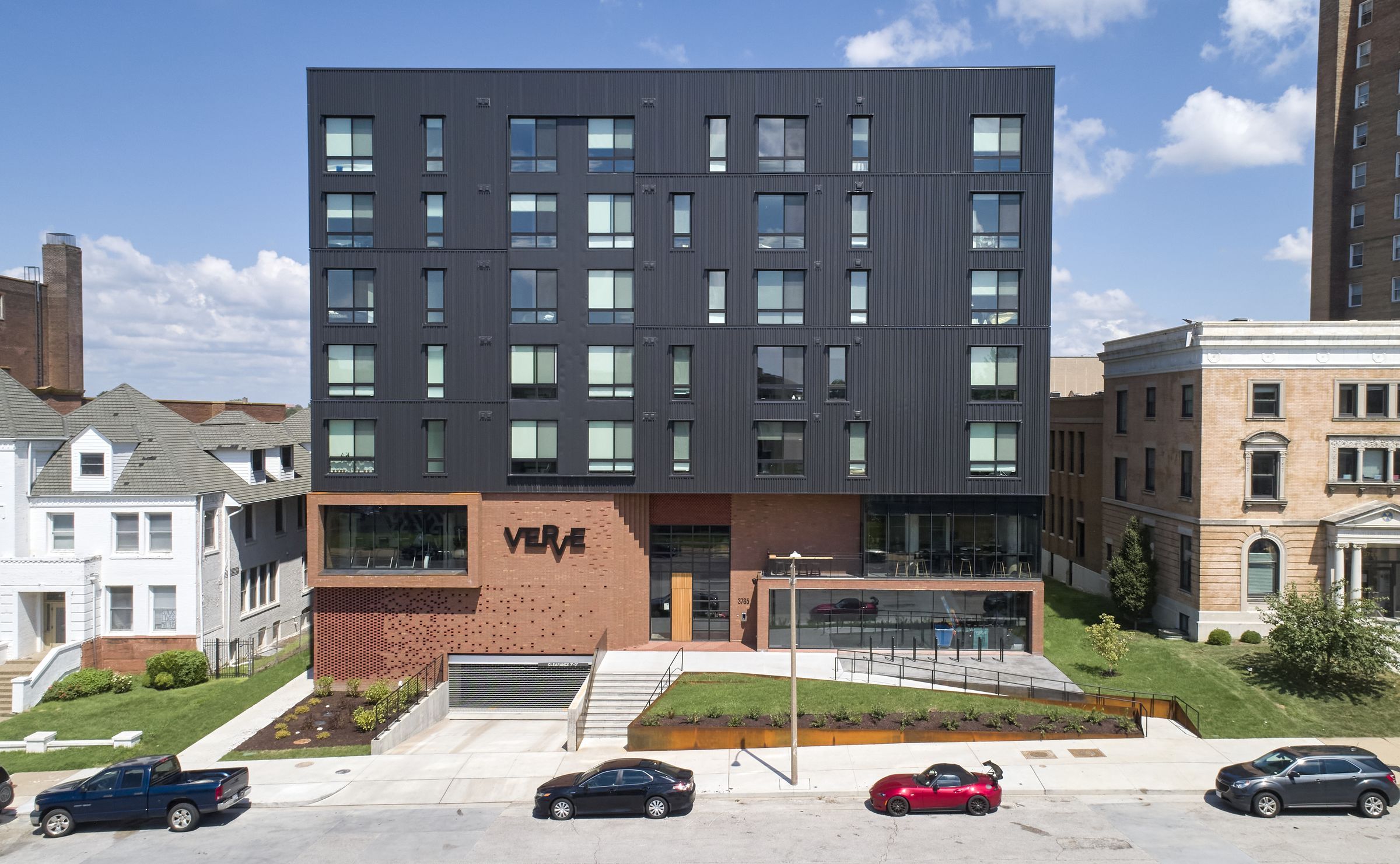 VERVE St. Louis exterior property view sowing modern building with brick bottom and dark metal paneling on top