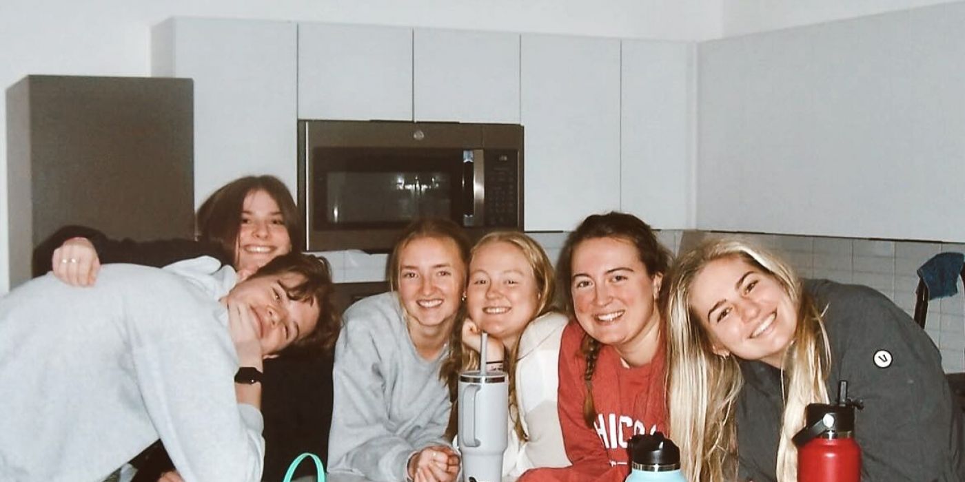 VERVE St.Louis friends hanging out in a kitchen smiling