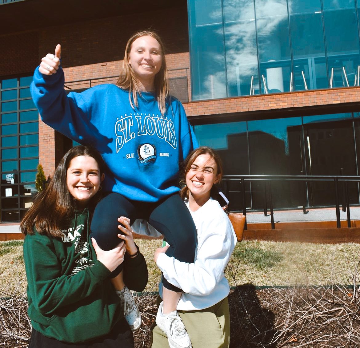 VERVE St Louis three girls outside of VERVE apartments smiling